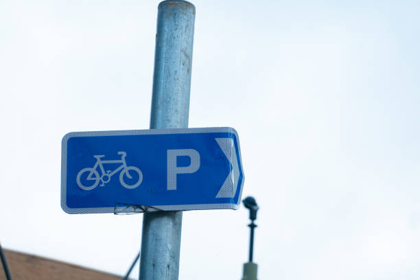 istock Bicycle lane signs and bike parking are rectangular posts mounted on streets. 1459704923