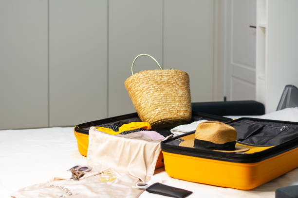 istock Preparation for the trip side view of an open suitcase 1459706691