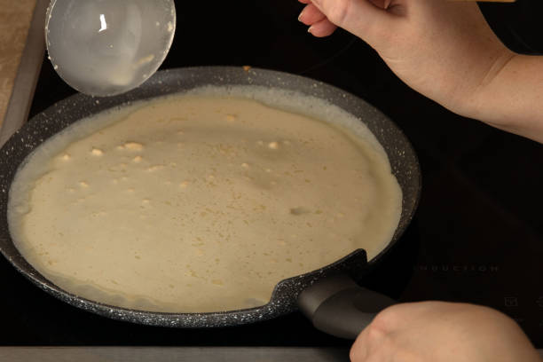 istock photo liquid dough frying in a pan 1459709812