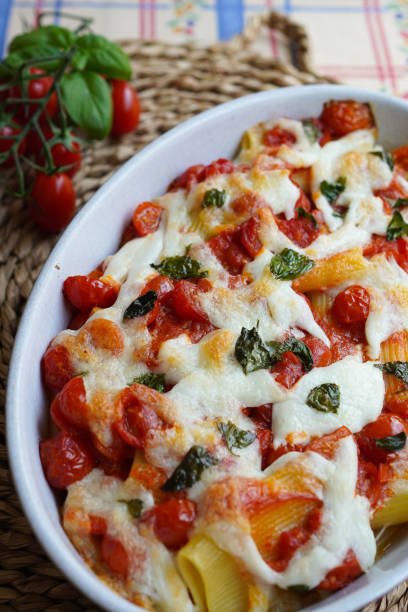 istock Italian baked pasta Paccheri with tomato, mozzarella cheese and fresh basil 1459713205