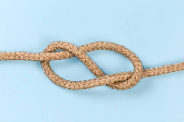 istock Rope knot as figure-eight knot on a blue background 1459719182