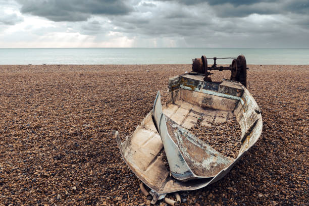 istock Old, abandoned boat on Brighton beach, United Kingdom 1459719234