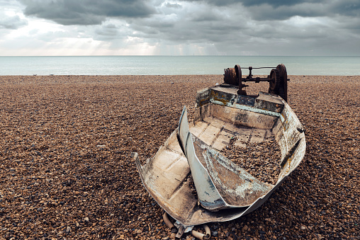 Old, abandoned boat on Brighton beach, United Kingdom