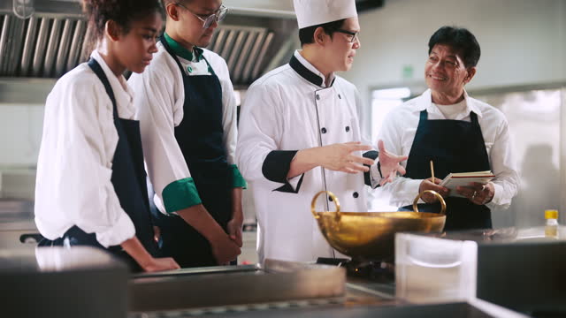 Students cooking in the kitchen as a group
