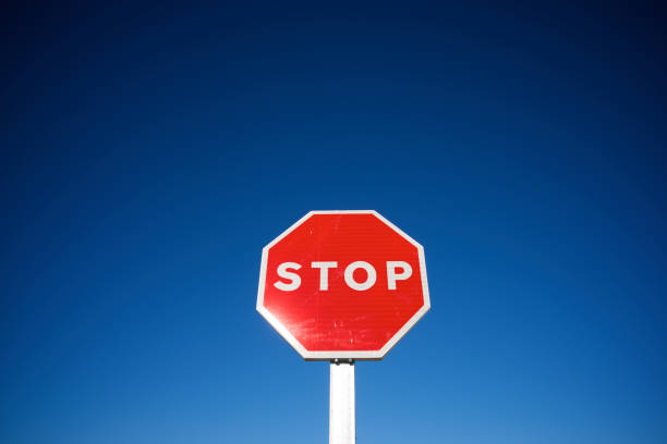 istock Stop traffic sign with cloudless sky. 1459719533