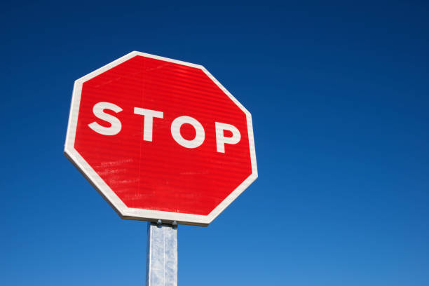 istock Stop traffic sign with cloudless sky. 1459719542