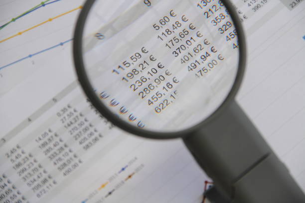 istock a statistic with a blank note, a magnifying glass and a pen 1459721440