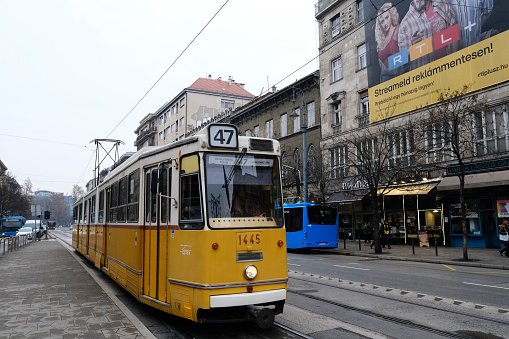 Typical yellow old tram in street of Budapest, Hungary on December 22, 2022.