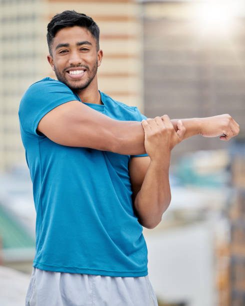istock Fitness, exercise and stretching with a sports man doing a warm up before a workout or training routine. Portrait, health and stretch with a male athlete getting ready for a cardio run outdoor 1459732863