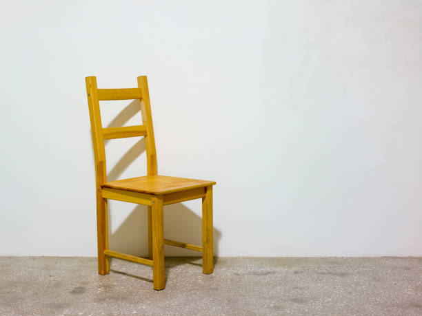 istock Wooden chair in an empty room 1459737597