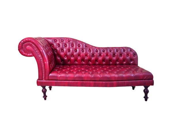 istock Retro red leather sofa with old wall, isolated on a white background 1459739540