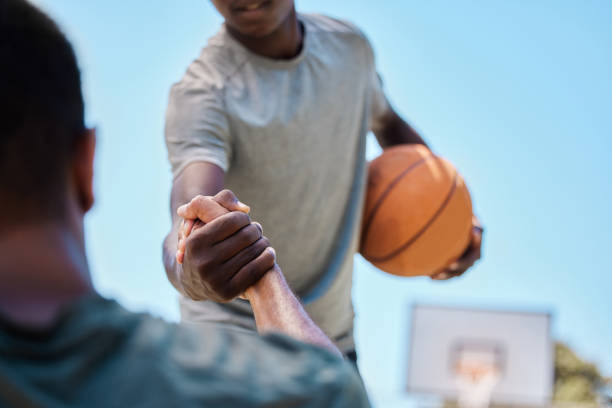 istock Basketball, help and team on a court playing a match, training or practicing together for a competition. Fitness, sports and man helping his friend on a basketball court during a game or practice. 1459744281