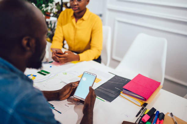 istock Male specialist messaging on smartphone at workspace 1459745762