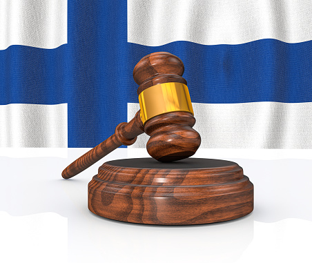 Finland Law Concept - Finnish Flag and Judge's Gavel