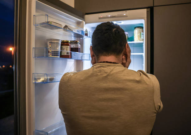 istock Upset Man In Front of an Open Fridge 1459753755
