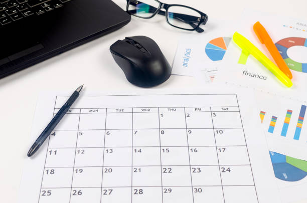 istock Working set for analyzing statistics and results of last year. Charts and graph with financial data, laptop, glasses. 1459754343