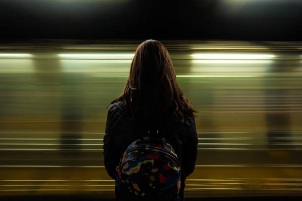 istock Woman watching the subway passing 1459757171