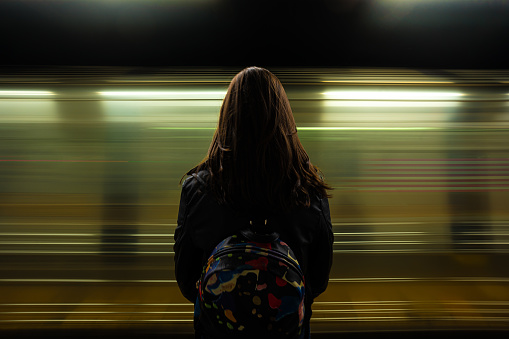 Woman watching the subway passing
