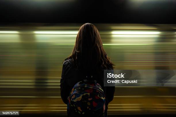 Woman Watching The Subway Passing Stock Photo - Download Image Now - Subway, Speed, Blurred Motion