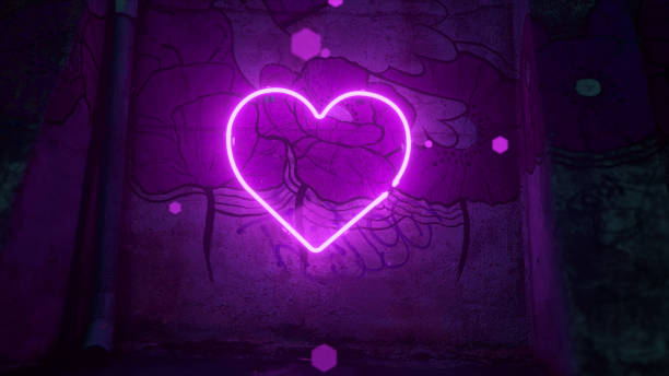 istock A violet neon heart flashes on a large wall with a flower pattern. Purple rhombus-shaped particles fly around. 1459757230