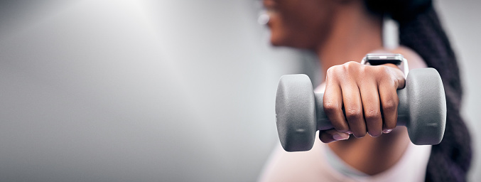 Hand with dumbbell, fitness and strong black woman with exercise zoom and weightlifting mock up, workout and muscle building. Weight training closeup, sport and power with healthy active lifestyle.