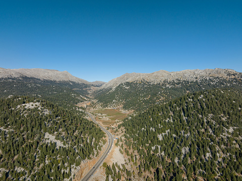 Aerial view of winding road between mountains. Antalya, Türkiye. Taken via drone.