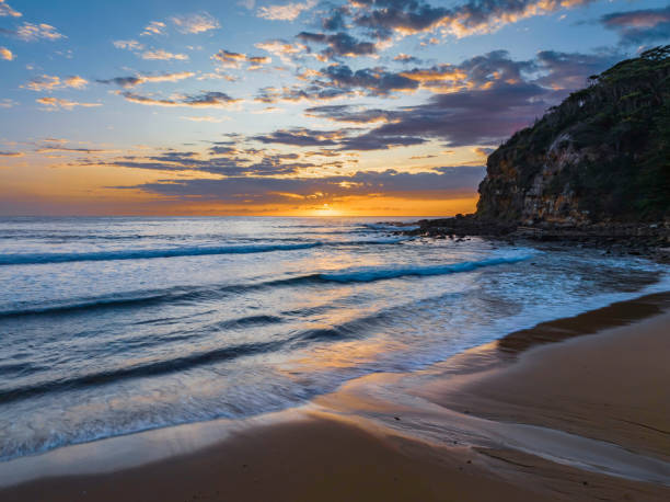 istock Sunrise at the seaside with clouds 1459761519