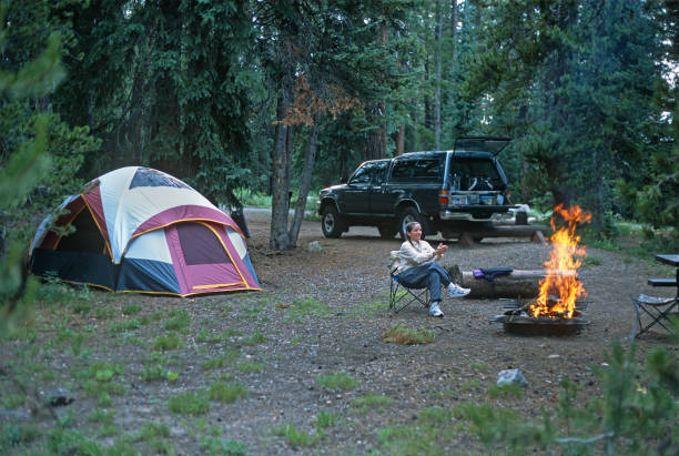 Woman tent camping near Rabbit Ears Pass Steamboat Colorado stock photo