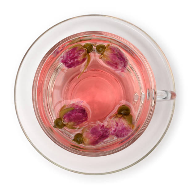 Rose tea in glass cup top view Rose tea in glass cup top view on white background pink tea stock pictures, royalty-free photos & images