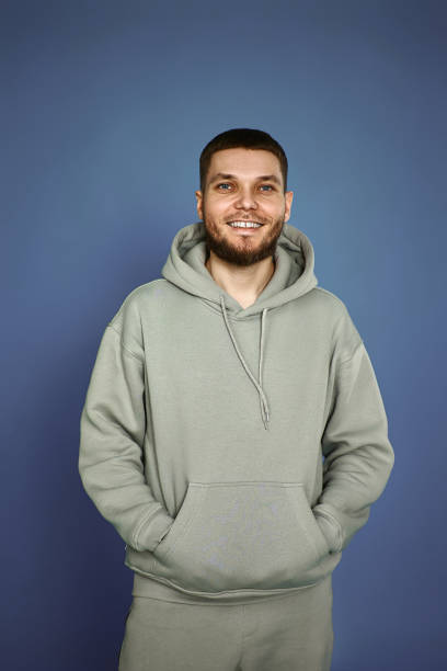 istock bearded man in sweatshirt on gray background. 1459767799