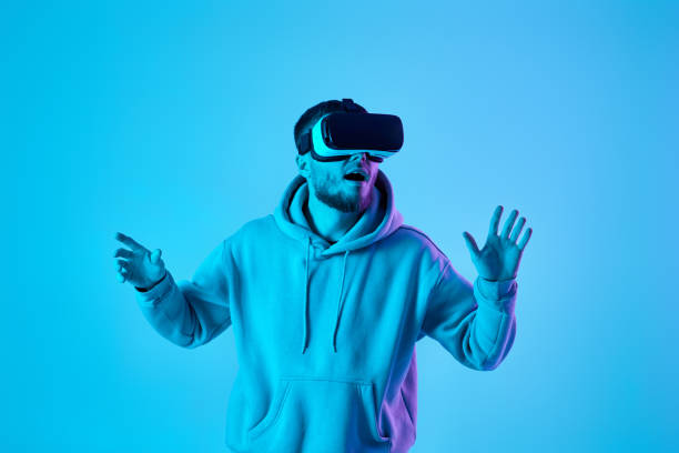 istock man using virtual reality glasses and playing video games 1459767884