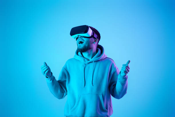 istock man using virtual reality glasses and playing video games 1459767922