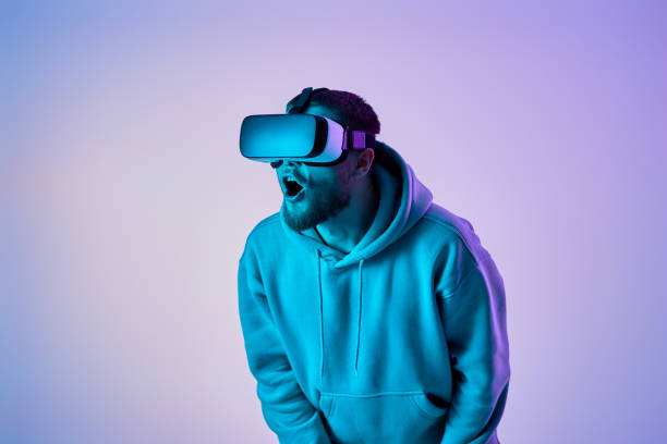 istock man using virtual reality glasses and playing video games 1459768133