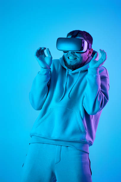 istock man using virtual reality glasses and playing video games 1459768259