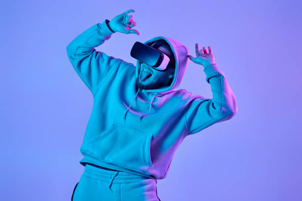 istock man using virtual reality glasses and playing video games 1459768474
