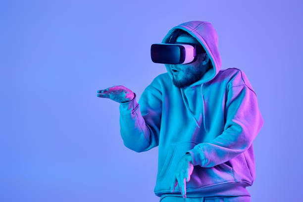 istock man using virtual reality glasses and playing video games 1459768495