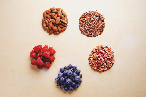 Granola ingredients, seed and fruits heaps