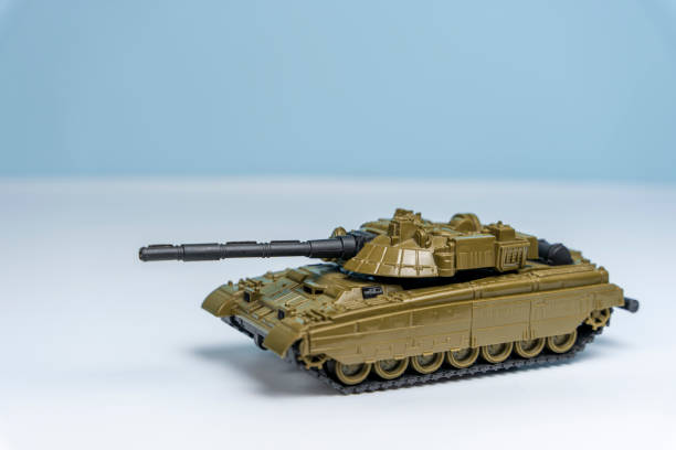istock toy military tank rides on the surface on a light background 1459774192