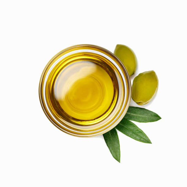istock Extra virgin olive oil and olives leaves isolated over white background 1459776002