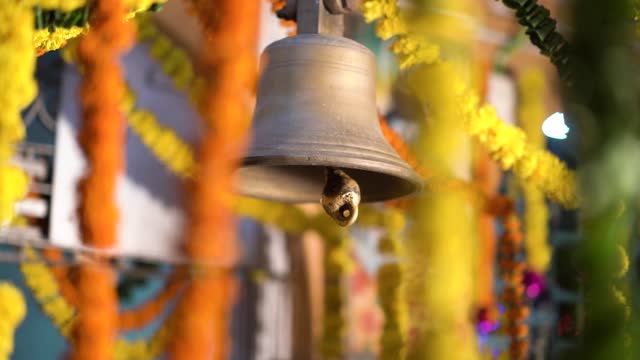 Diwali Indian Festival Decoration, Hindu Temple Bell Closeup | Brass-made bell is being rang by a person - Traditional backgrounds