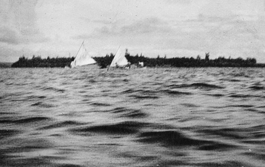 Canoe sailing on the Churchill River in Saskatchewan, Canada. Vintage photograph ca. 1919.