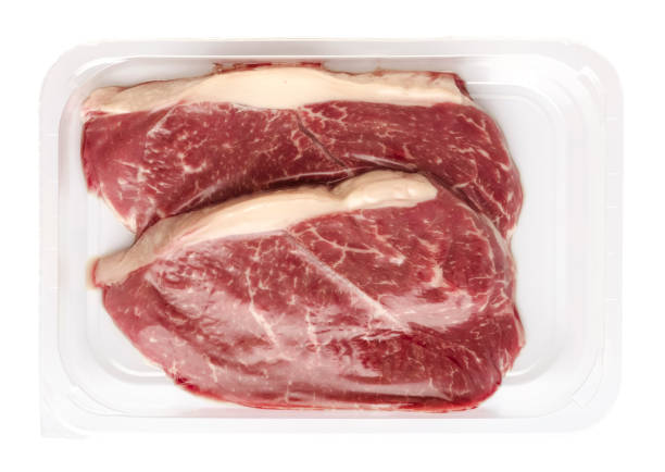 istock Fresh raw beef steaks in vacuum packaging on a white background 1459780381
