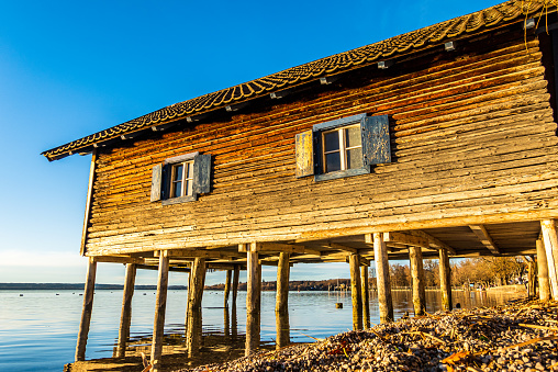 typical old boat hut at a lake - bavaria