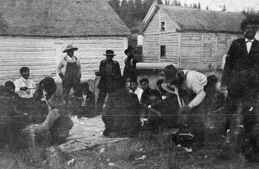 Pelican Narrows, Saskatchewan, Canada - 1919. Chief Peter Ballantyne and a group of Cree people celebrating Treaty Day at Pelican Narrows in Saskatchewan, Canada.
