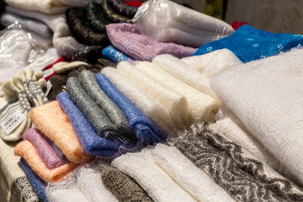 istock Stack of knitted wool Orenburg scarves. Crochet, pattern. 1459785331