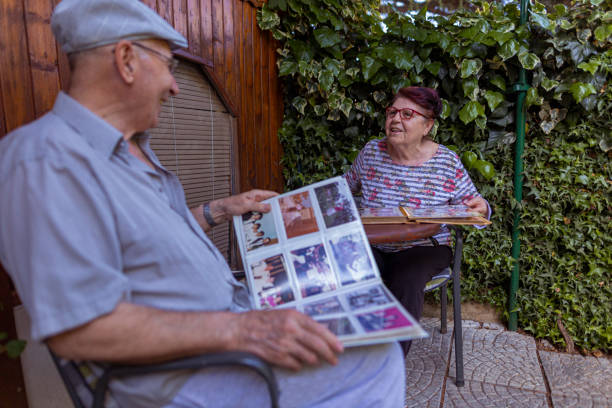 istock Sitting together and looking at old photos 1459786361