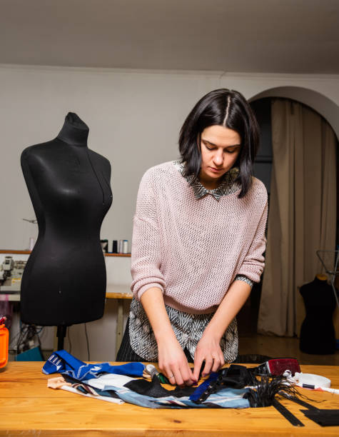 istock Seamstress works in the tailoring workshop 1459786613