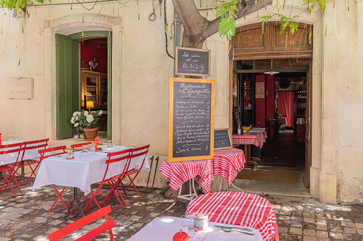 Aigues-Mortes, Gard, Occitania, France. July 4, 2022. Sidewalk cafe in southern France.