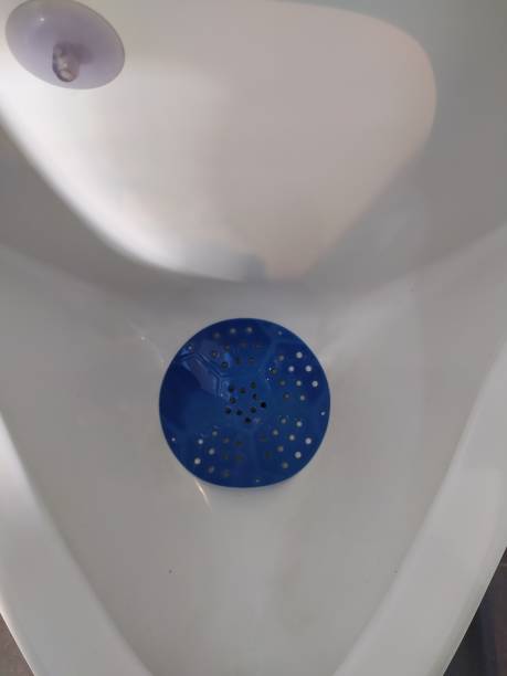 istock Closeup of a urinal in a public bathroom 1459794598