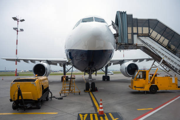 istock Passenger airplane on the airfield docked with passenger boarding bridge 1459797941